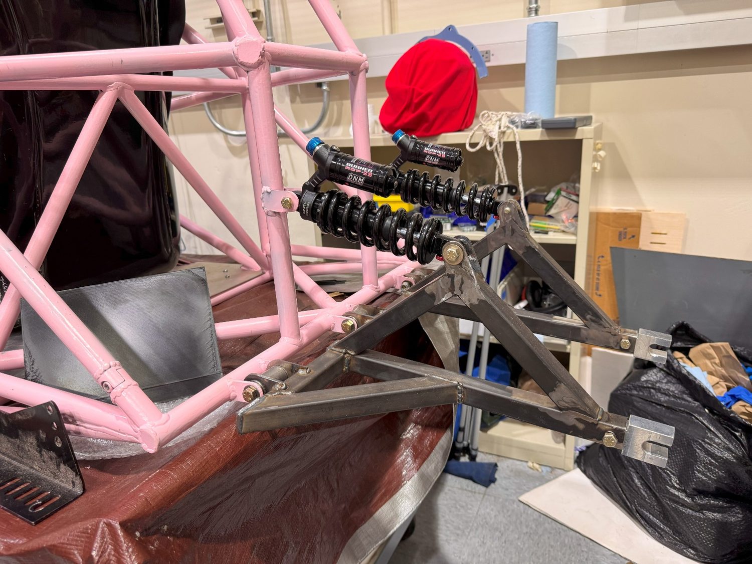 Close-up of the assembled rear suspension pushrod and rockers