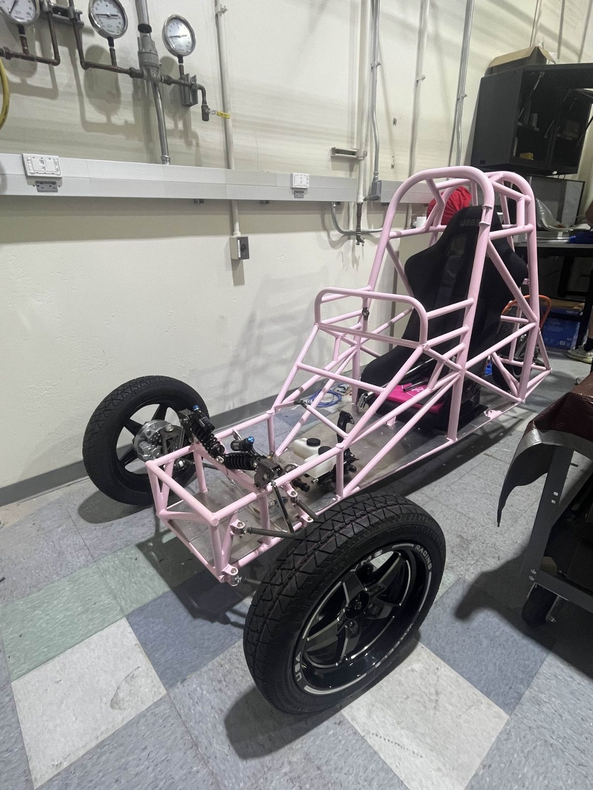 The finished rolling chassis on its four wheels, three-quarter front view