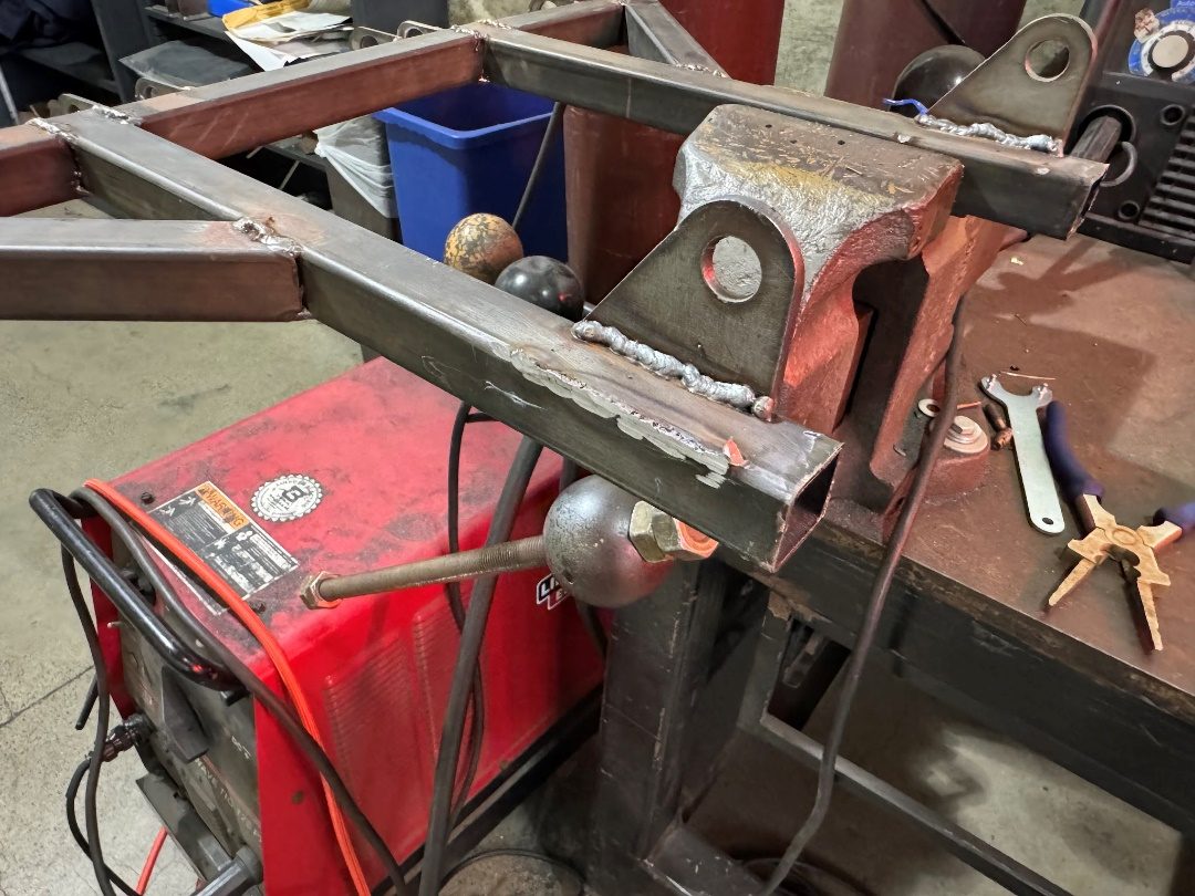 Welding suspension tabs onto the chassis at the bench